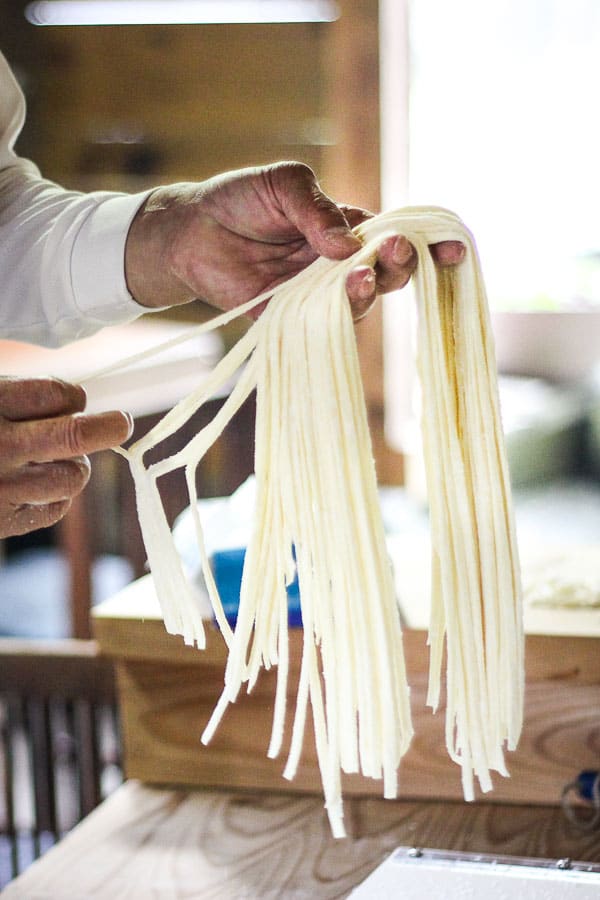 Shikoku Mountain-Style Udon Noodles - A foot-crafted recipes of delectable noodles from the Udon Master in Shikoku, Japan. Slurp yourself happy with this moreish dinner delight. | wandercooks.com