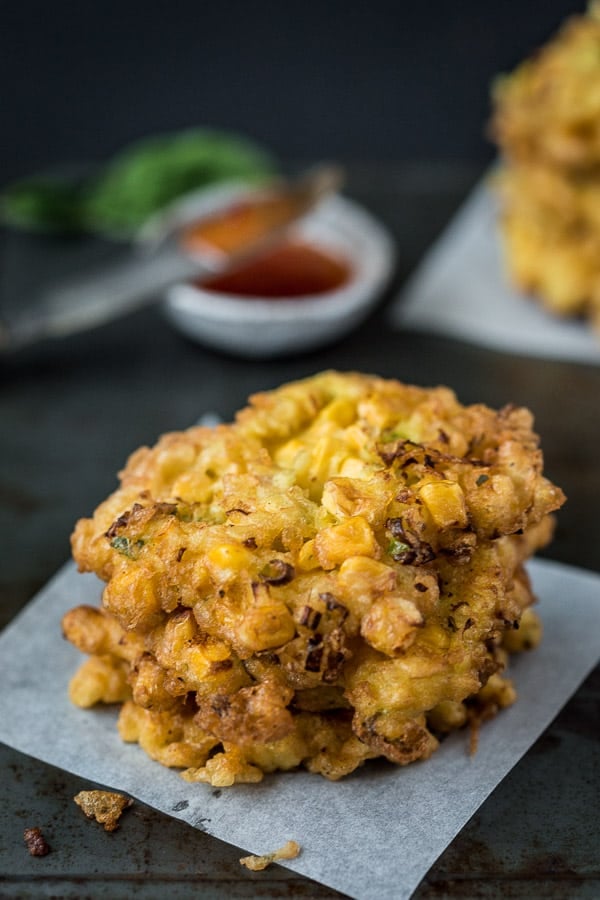 A stack of fried corn fritters known as bakwan jagung