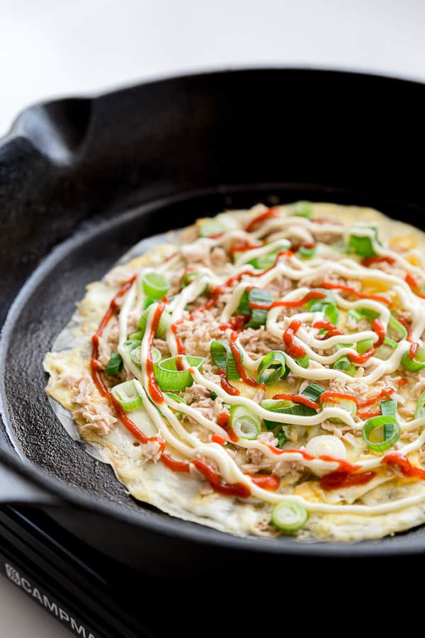Vietnamese Pizza (Bánh Tráng Nướng) Recipe - Grilled rice paper turned popular street food pizza snack. Easily cooked at home, with toppings such as egg, spring onion, canned meat (we LOVE tuna on ours) and finished with mayonnaise and sriracha. | wandercooks.com #vietnamese #pizza #ricepaper #grilled #wandercooks