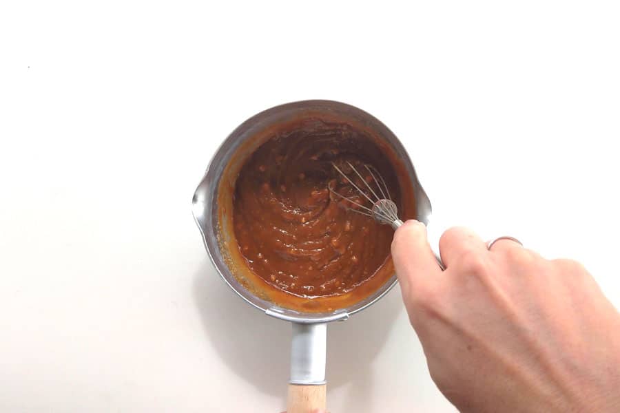 Dipping sauce ingredients being mixed in a saucepan