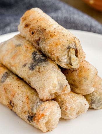 A pyramid of Vietnamese fried spring rolls on a plate.
