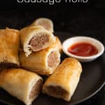 Close up of sausage rolls with tomato sauce and the words "Sausage Rolls".