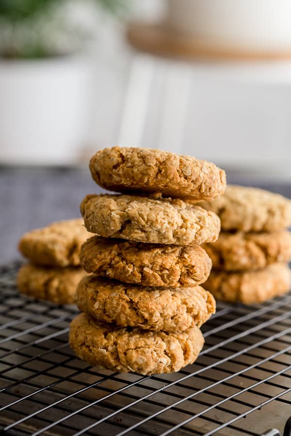 Anzac biscuits in a pile on top of each other.