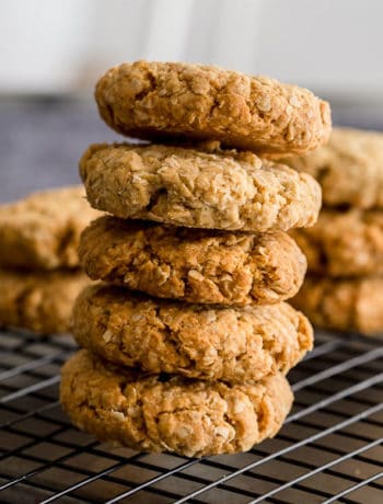 Anzac biscuits in a pile on top of each other.