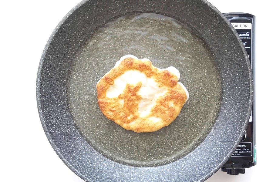 Frying pizza in shallow oil.