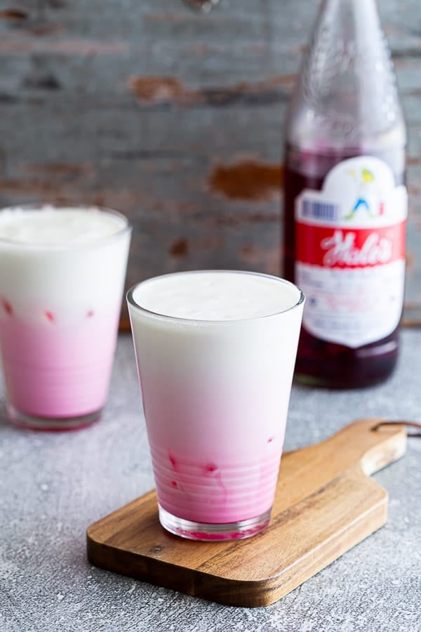 Two glasses of pink milk with Hale's Blue Boy Sala syrup.