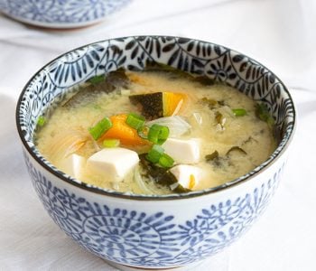 Bowl of Japanese miso soup with pumpkin and tofu.