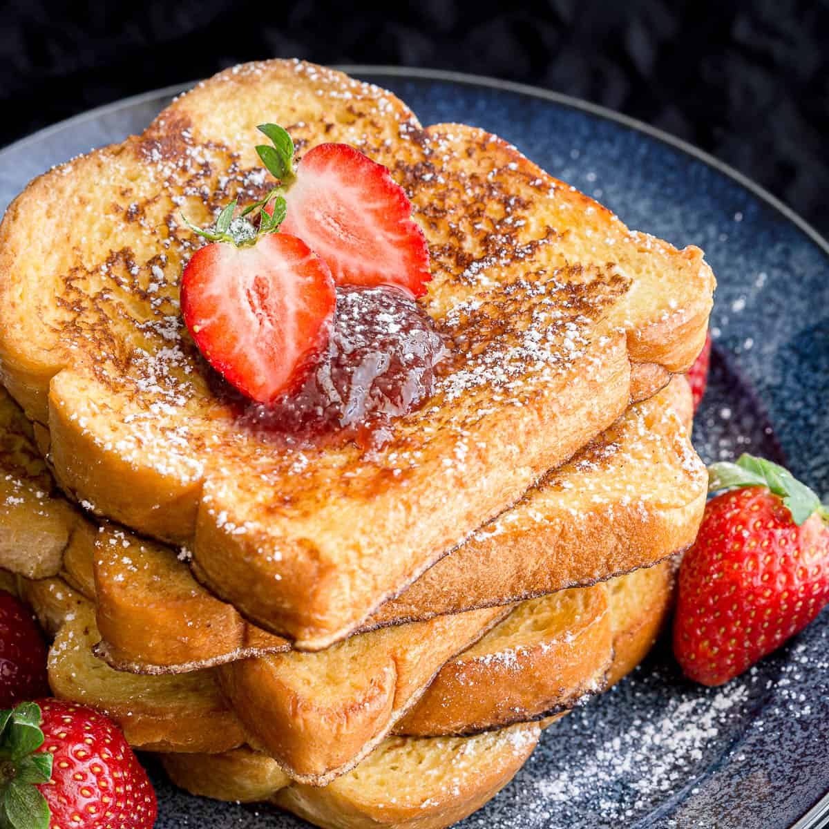 A stack of freshly cooked brioche French toast.