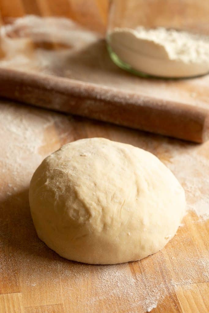 Ball of fresh pizza dough, ready to roll out into pizza bases.