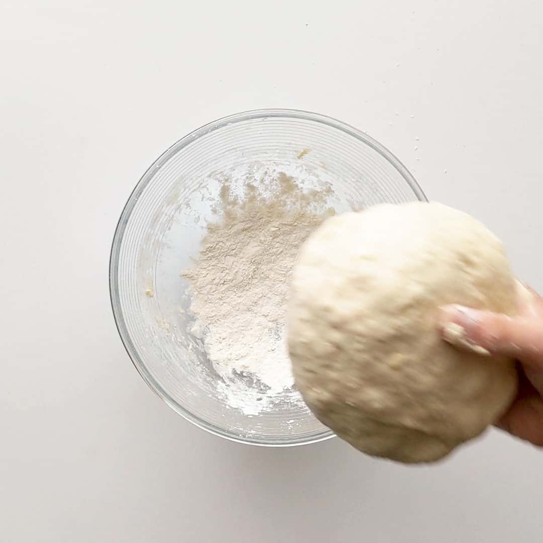 Adding flour to base of dough before rising.