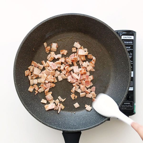 Frying bacon in the pan.