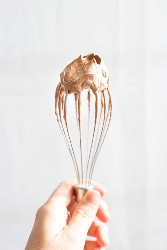 Chocolate mousse on a whisk.