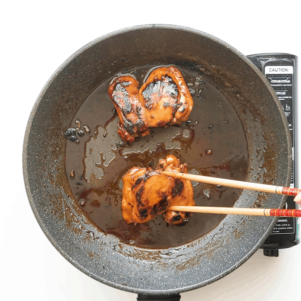 Reducing the teriyaki sauce to a glaze with the chicken.