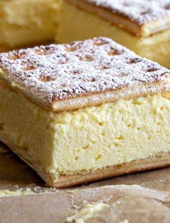 The finished vanilla slice made with lattice biscuits and instant dessert mix, sprinkled with icing sugar.