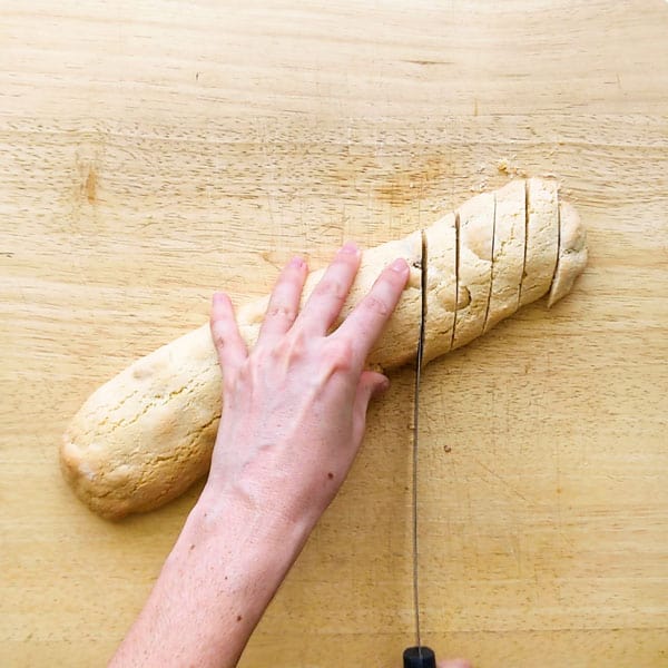 Slicing cantucci with serrated knife.