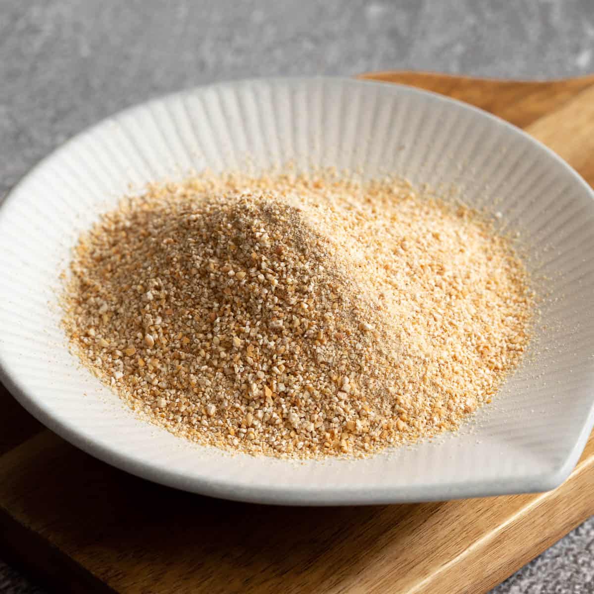 Small white dish with Thai toasted rice powder.
