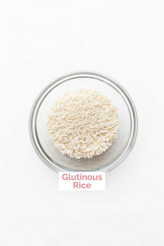 Small dish of raw glutinous rice.