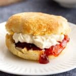 Jam and cream filled plain scone with crispy outside texture.
