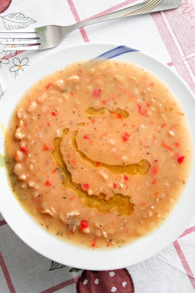 Jani me fasule (white bean soup) with olive oil splashed on top.