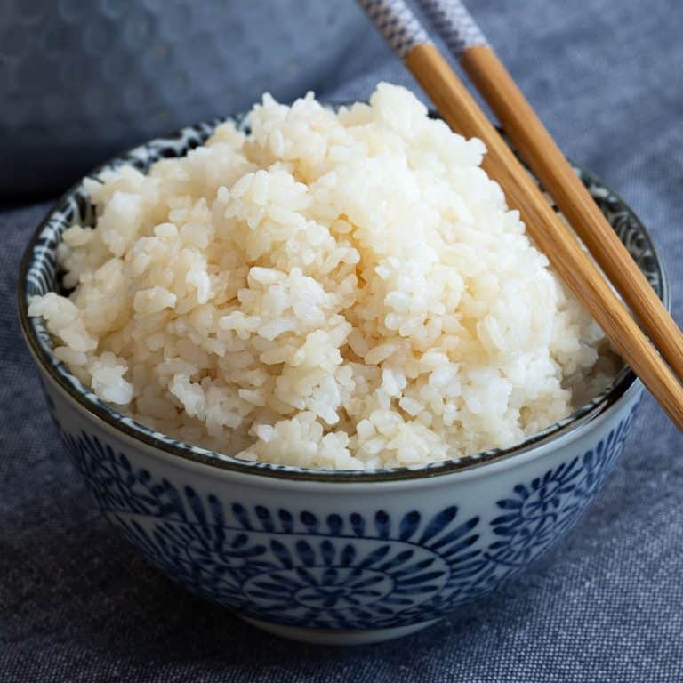 Bowl of fluffy white sushi rice made in the instant pot.