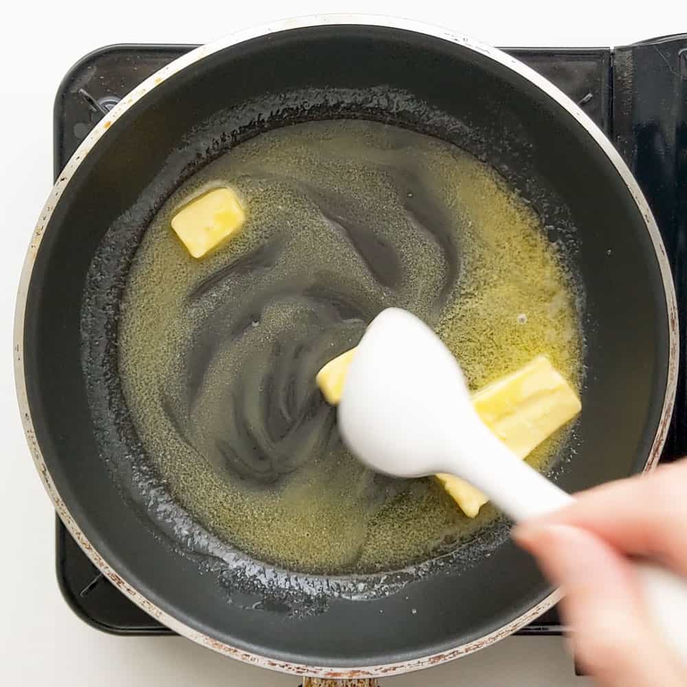 Mixing the melted butter.