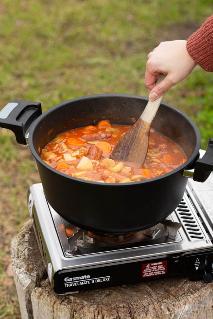 Cooking campfire stew over gas in Remoska tria cooker.