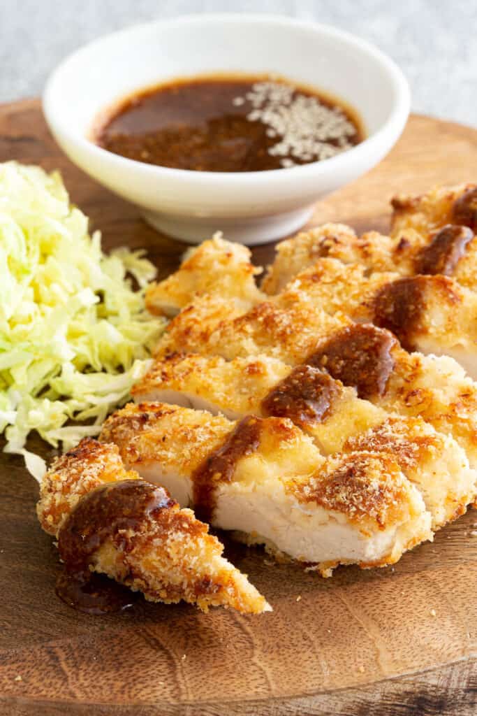 Breaded fried chicken with a drizzle of homemade tonkatsu sauce.
