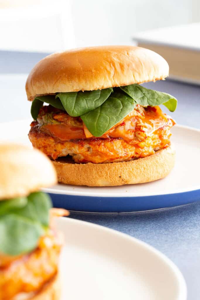 Spicy chickjen burger stuffed with spinach and kimchi.