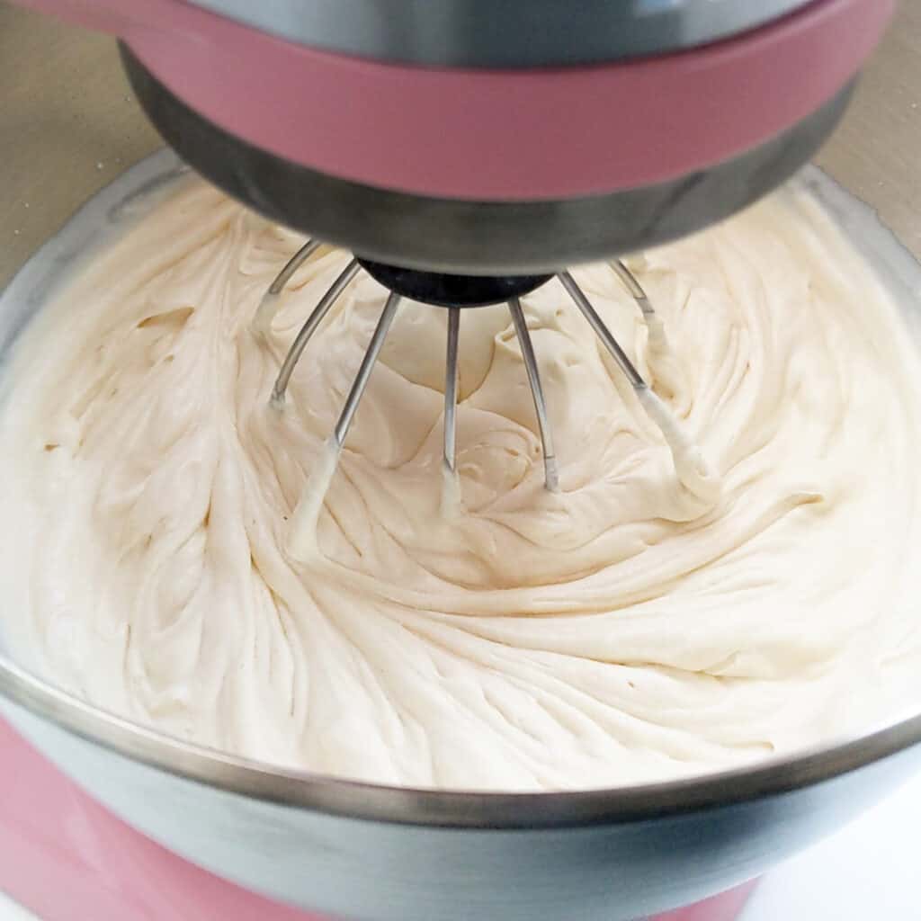 Whipping cream in KitchenAid mixer.
