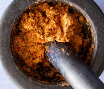 Top view of Panang curry paste in a mortar and pestle.
