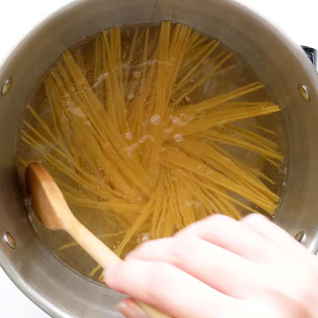 Cooking pasta in boiling water.