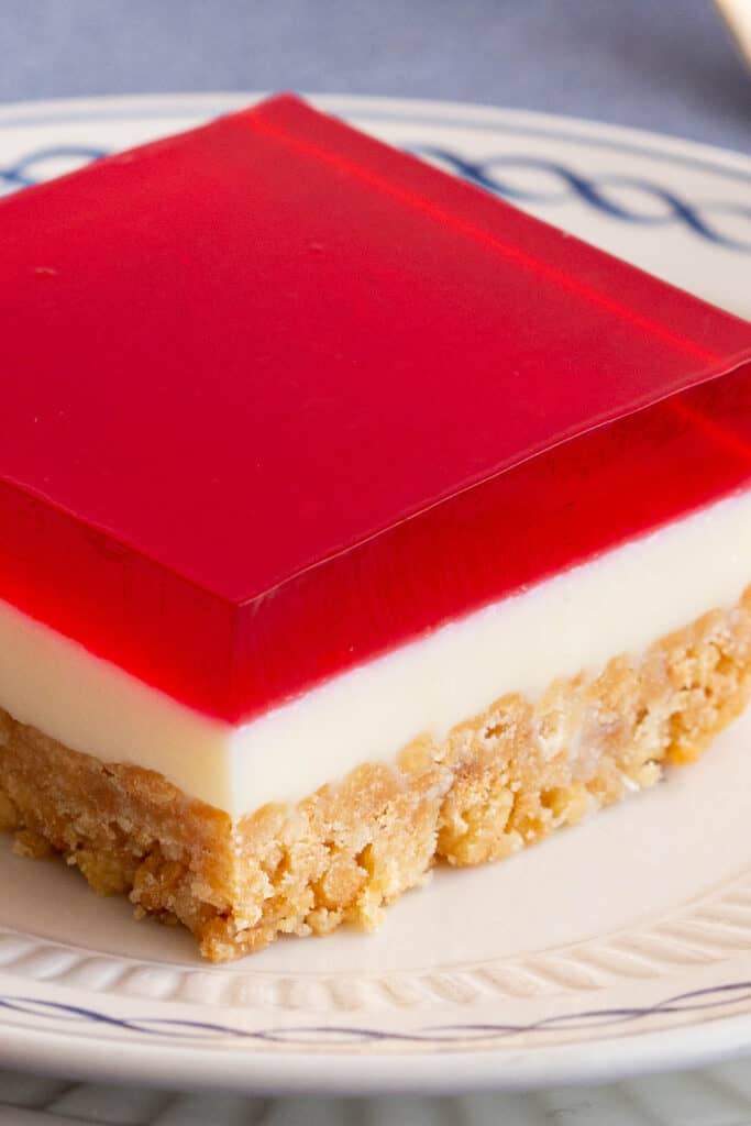 Close up of jelly slice layers - biscuit, condensed milk and jelly.