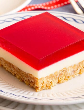 Square piece of jelly slice on a small plate.