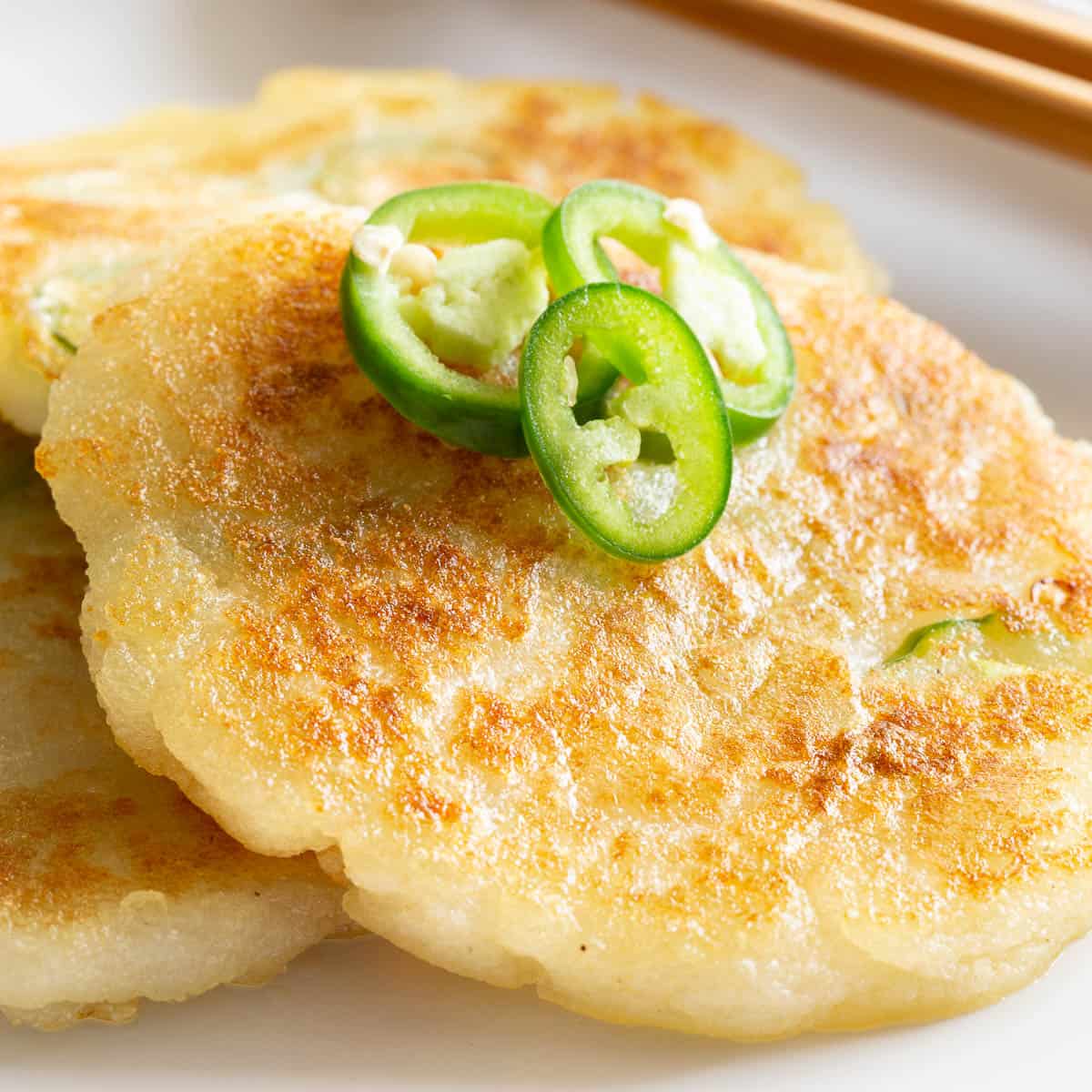 Crispy Korean potato pancakes topped with slivers of green chilli.