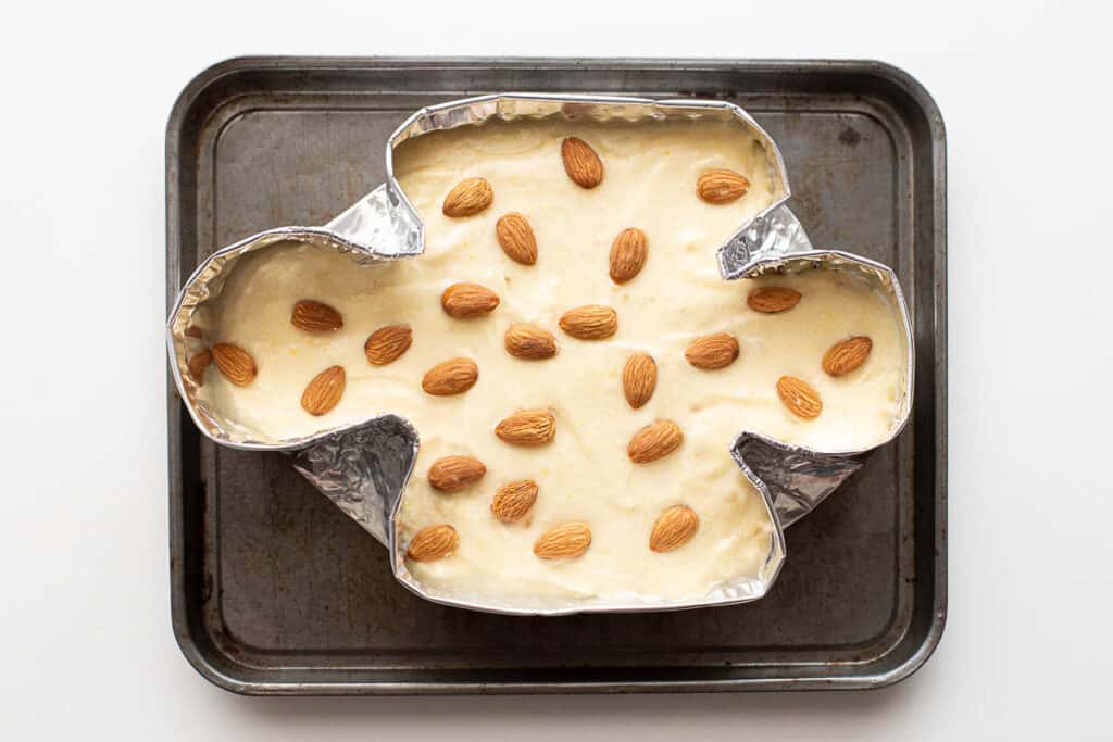 Whole almonds placed on cake mix as a topping.