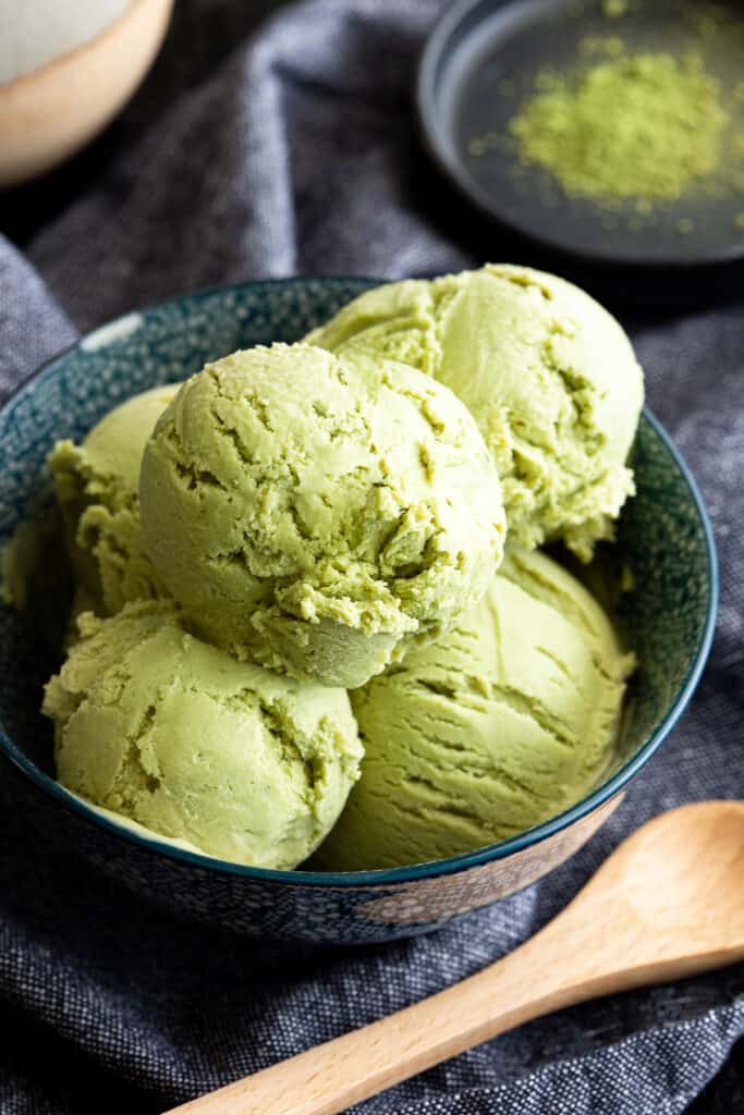 Small blue bowl filled with Japanese matcha ice cream.