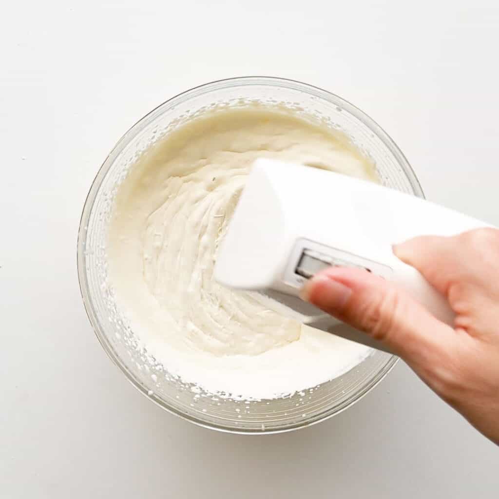 Whipping cream with beaters.