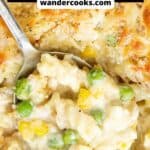Large spoonful of creamy tuna mornay with corn and peas.