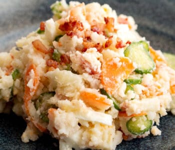 Close up shot of colourful Japanese potato salad on a plate.
