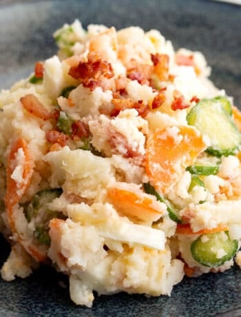 Close up shot of colourful Japanese potato salad on a plate.