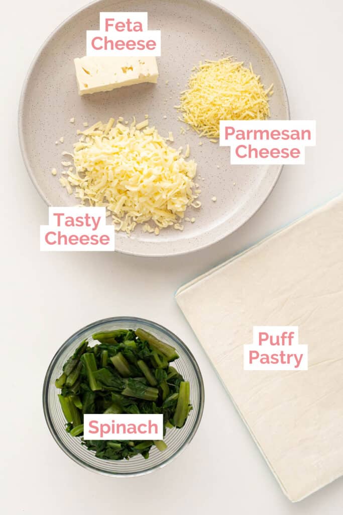Ingredients laid out for spinach and feta cheese triangles.
