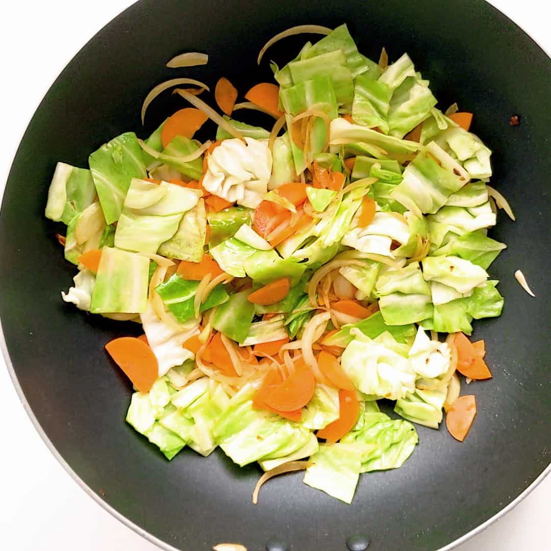 Stir fried vegetables in a wok.