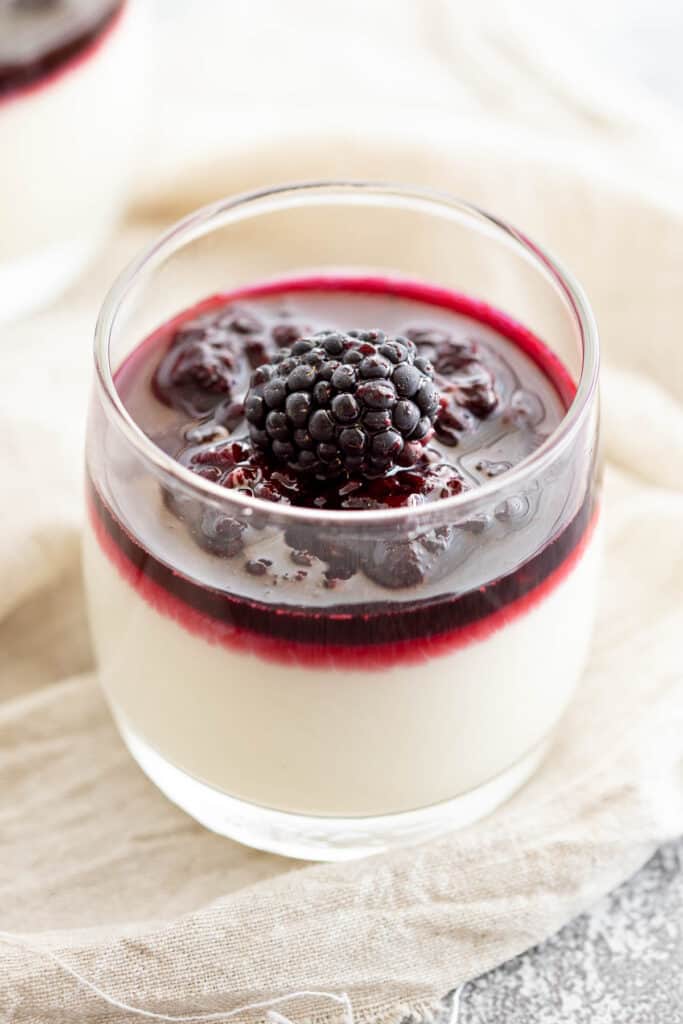 Blancmange in a clear glass topped with coulis to show the beautiful layers.