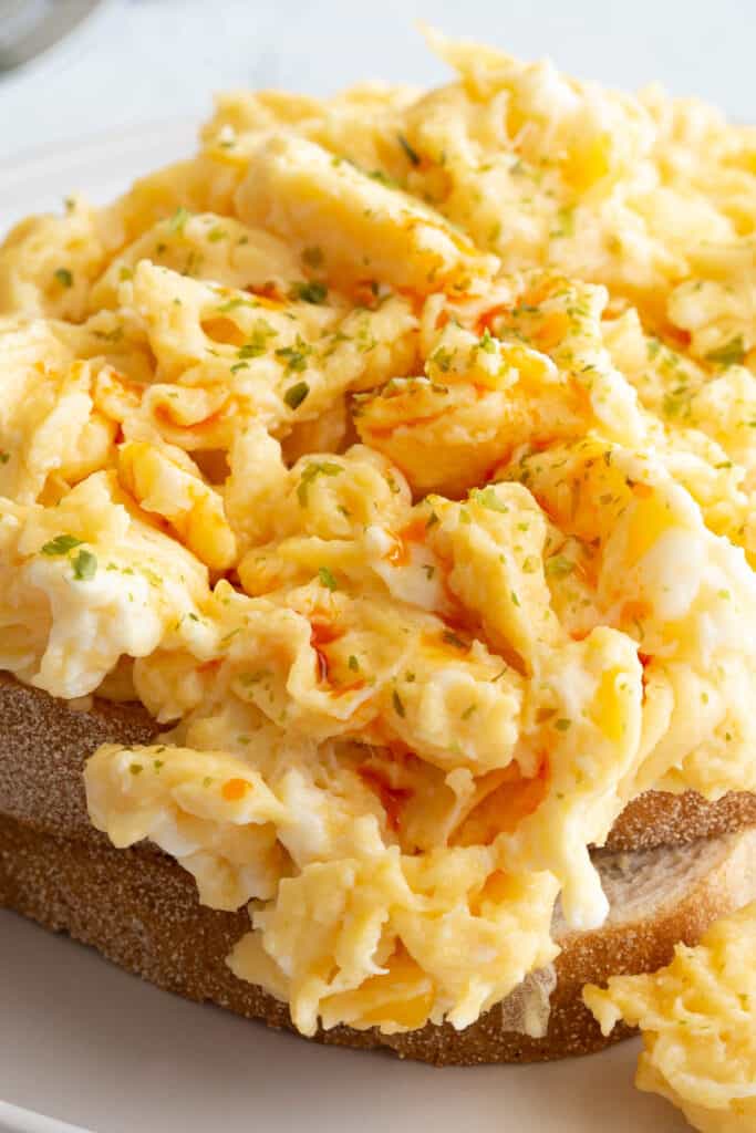 Chilli oil winds its way through fluffy scrambled eggs on toast.