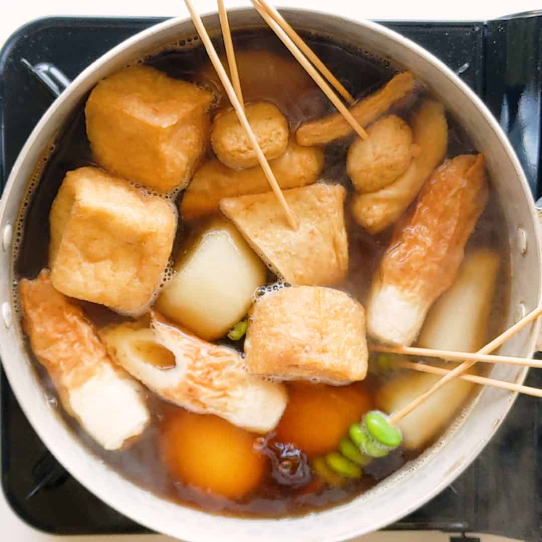 Oden filled with fish cakes, edamame, tofu and daikon.
