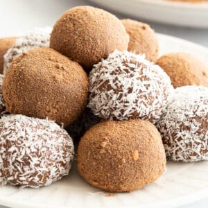A stack of coated chocolate coconut balls, ready to eat.
