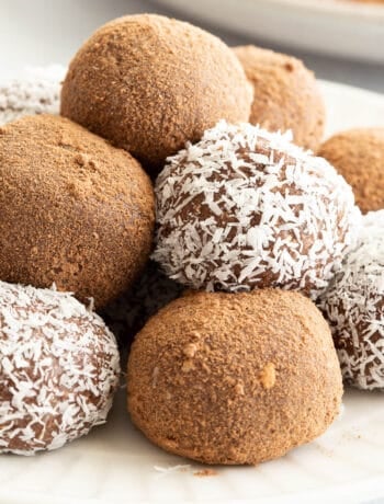 A stack of coated chocolate coconut balls, ready to eat.