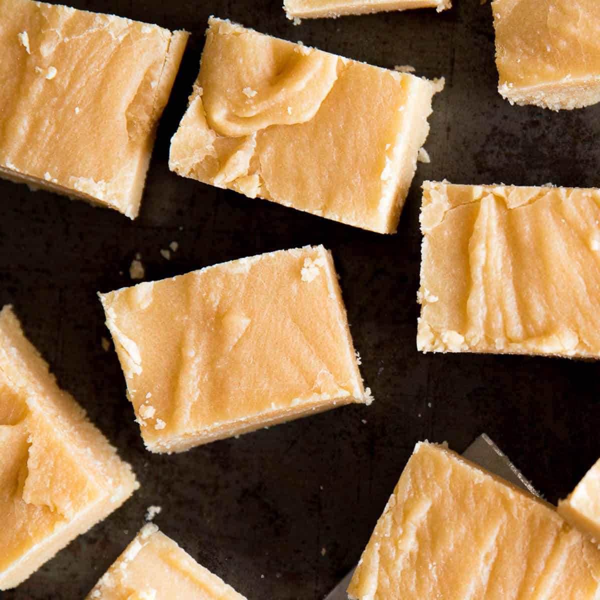Golden slices of Scottish tablet on a baking tray.