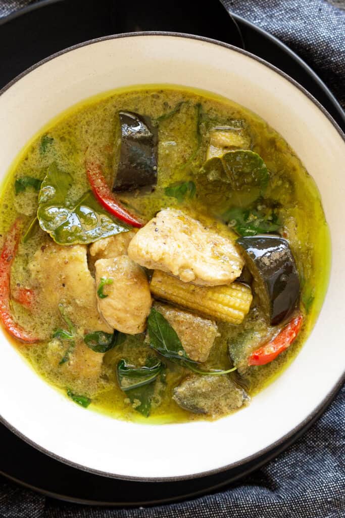 A top down view of a bowl of Thai green curry.