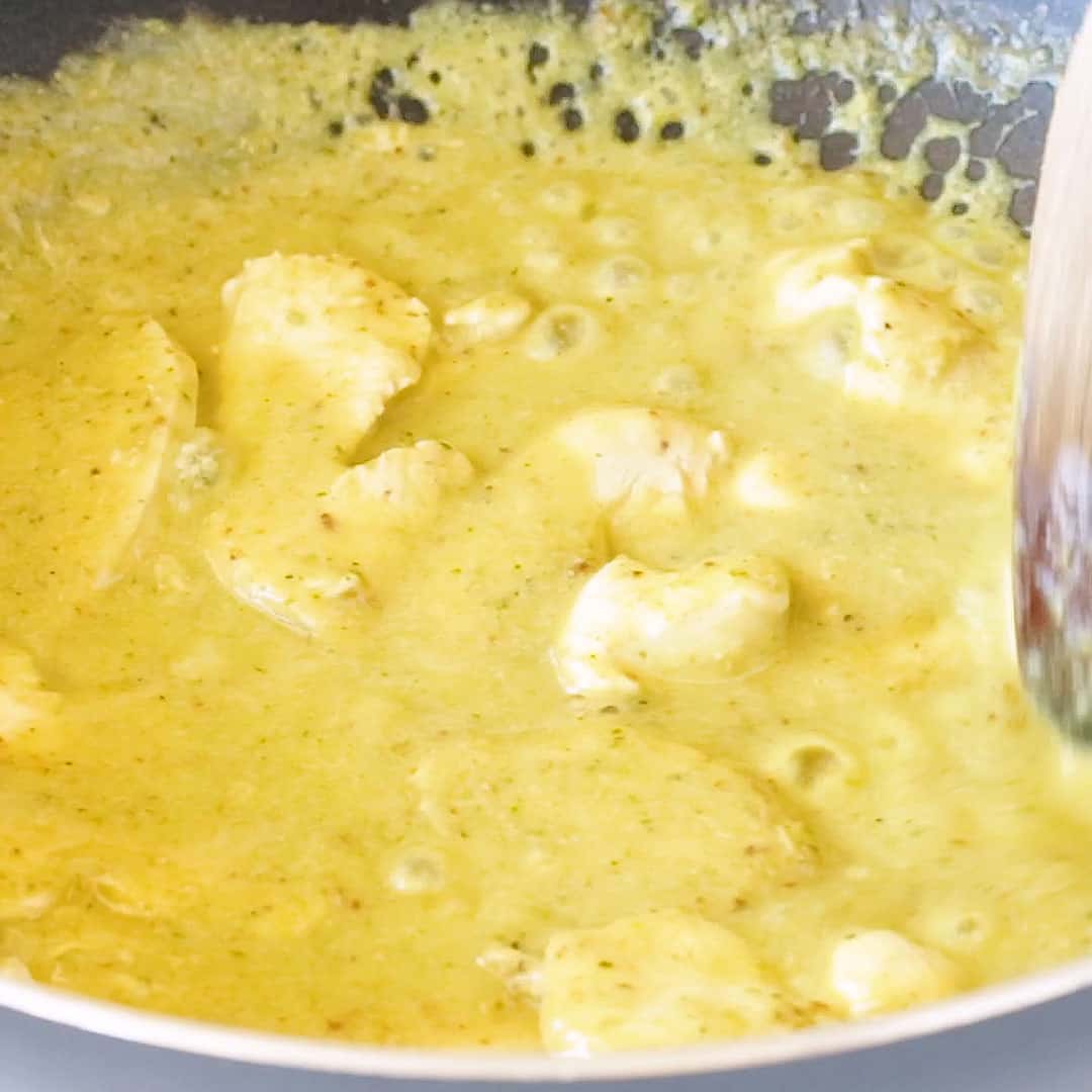 Cooking the chicken in with the curry paste and coconut milk.
